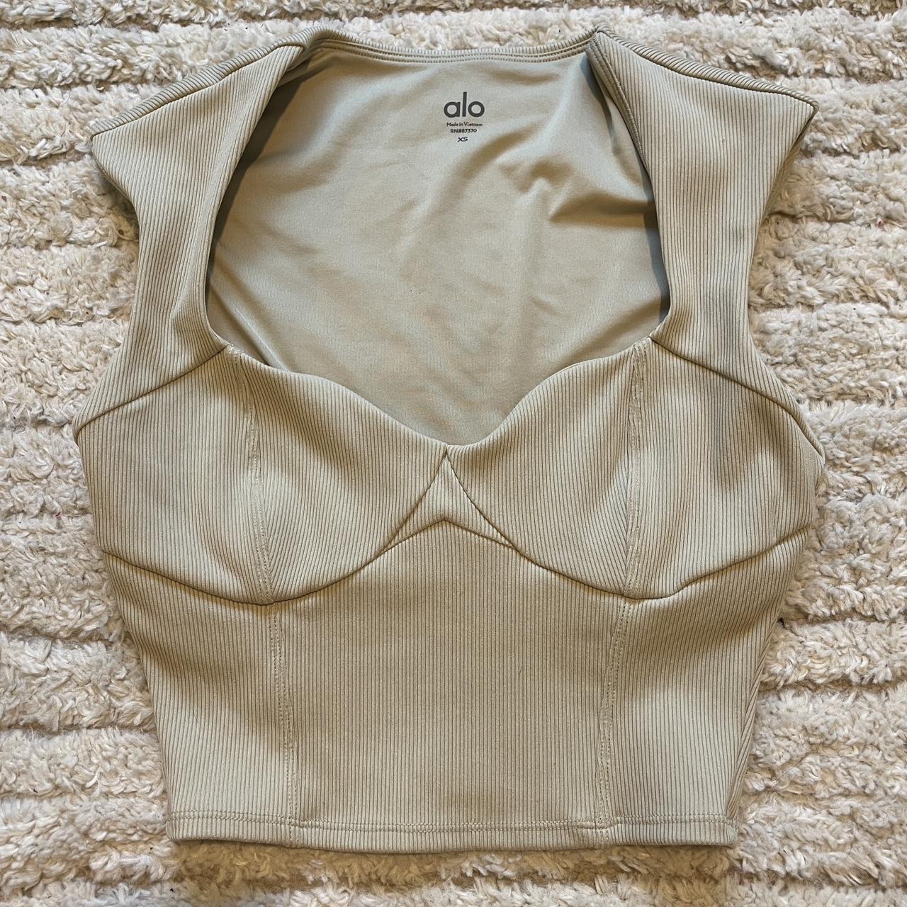 tan alo yoga top worn once. size xs. cups are