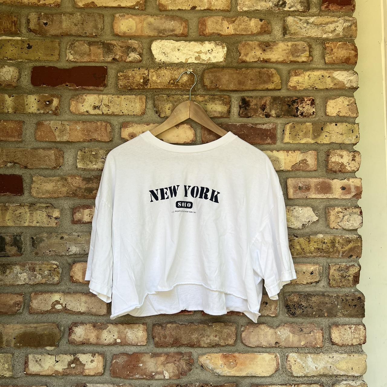 brandy melville white new york soho cropped top. one... Depop