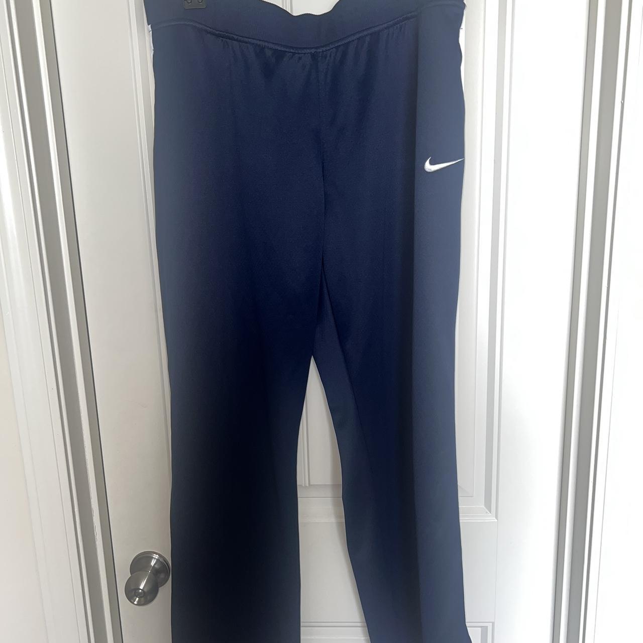 Nike pants hot sale zipper bottom