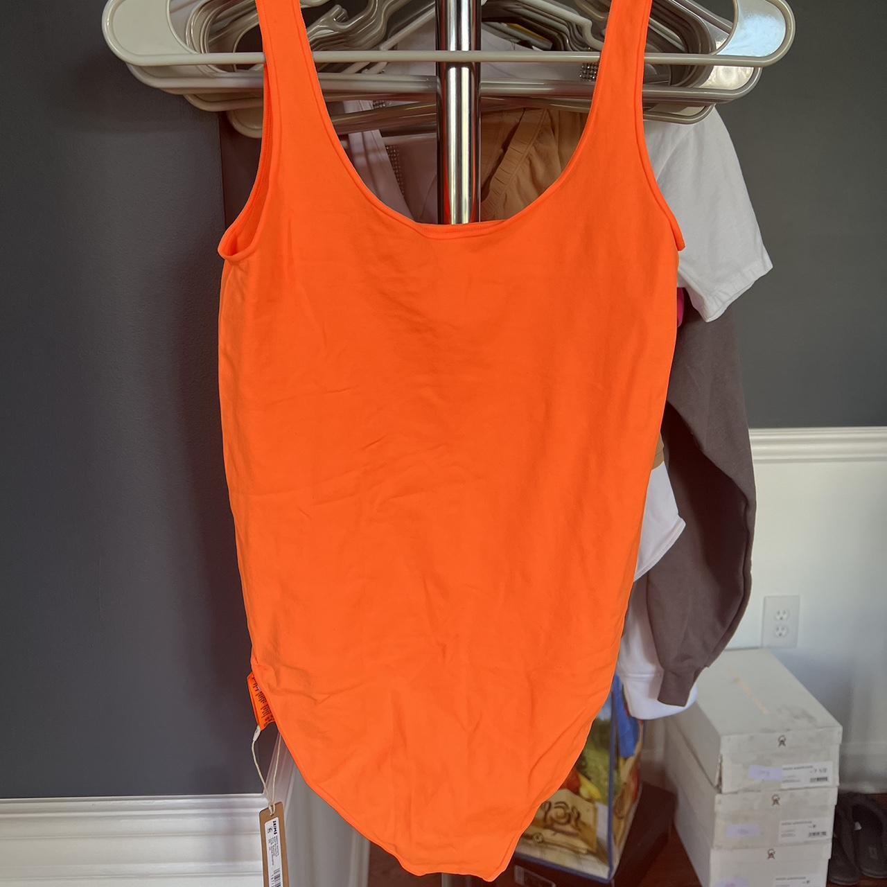 NWT SKIMS ESSENTIALS SCOOP NECK BODYSUIT ORANGE... Depop
