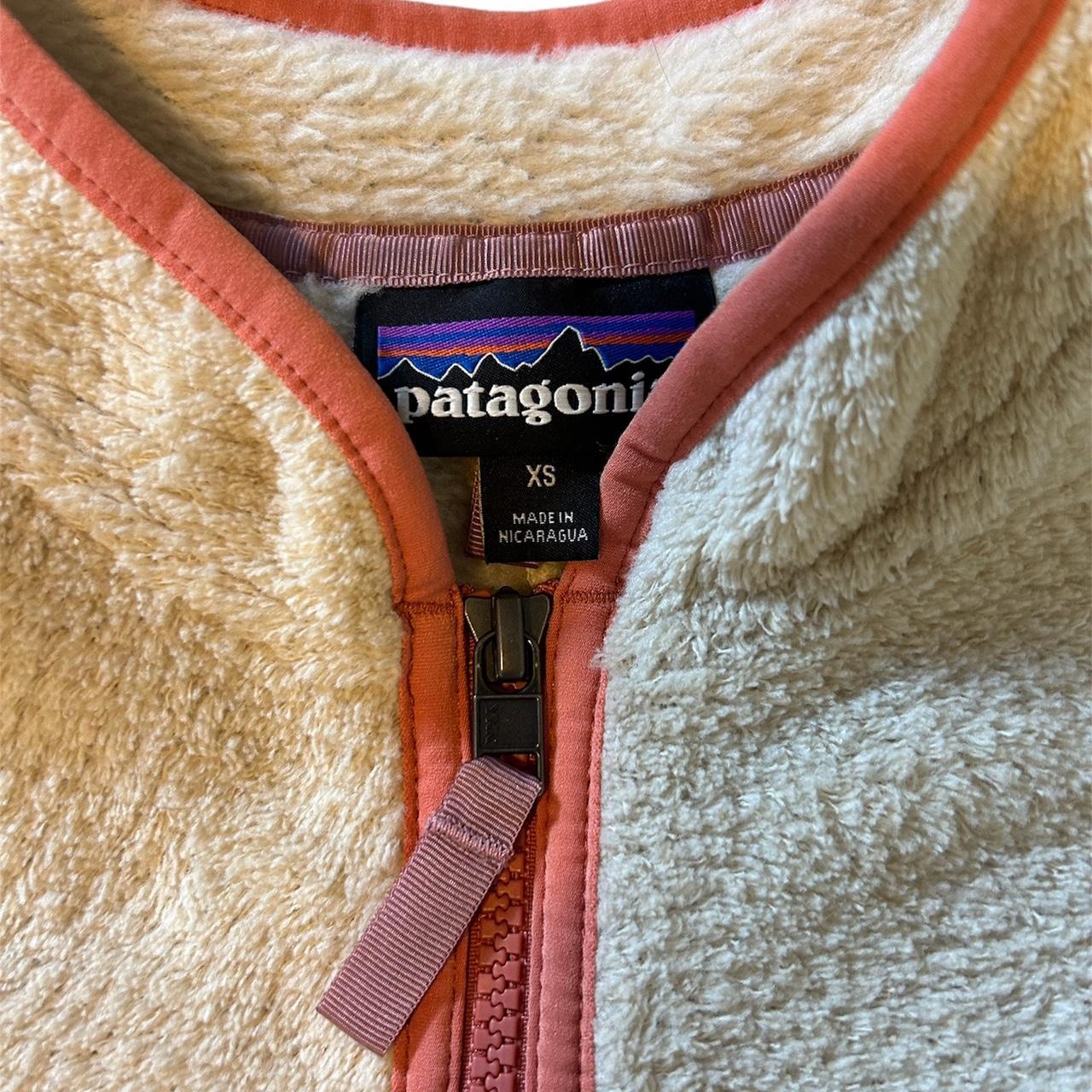 Cream Patagonia Fleece with peach color pocket and... - Depop