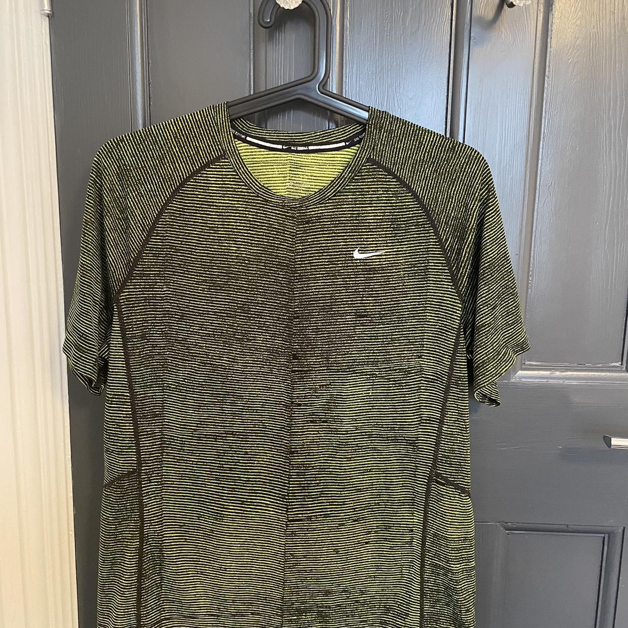 grey and neon green nike shirt