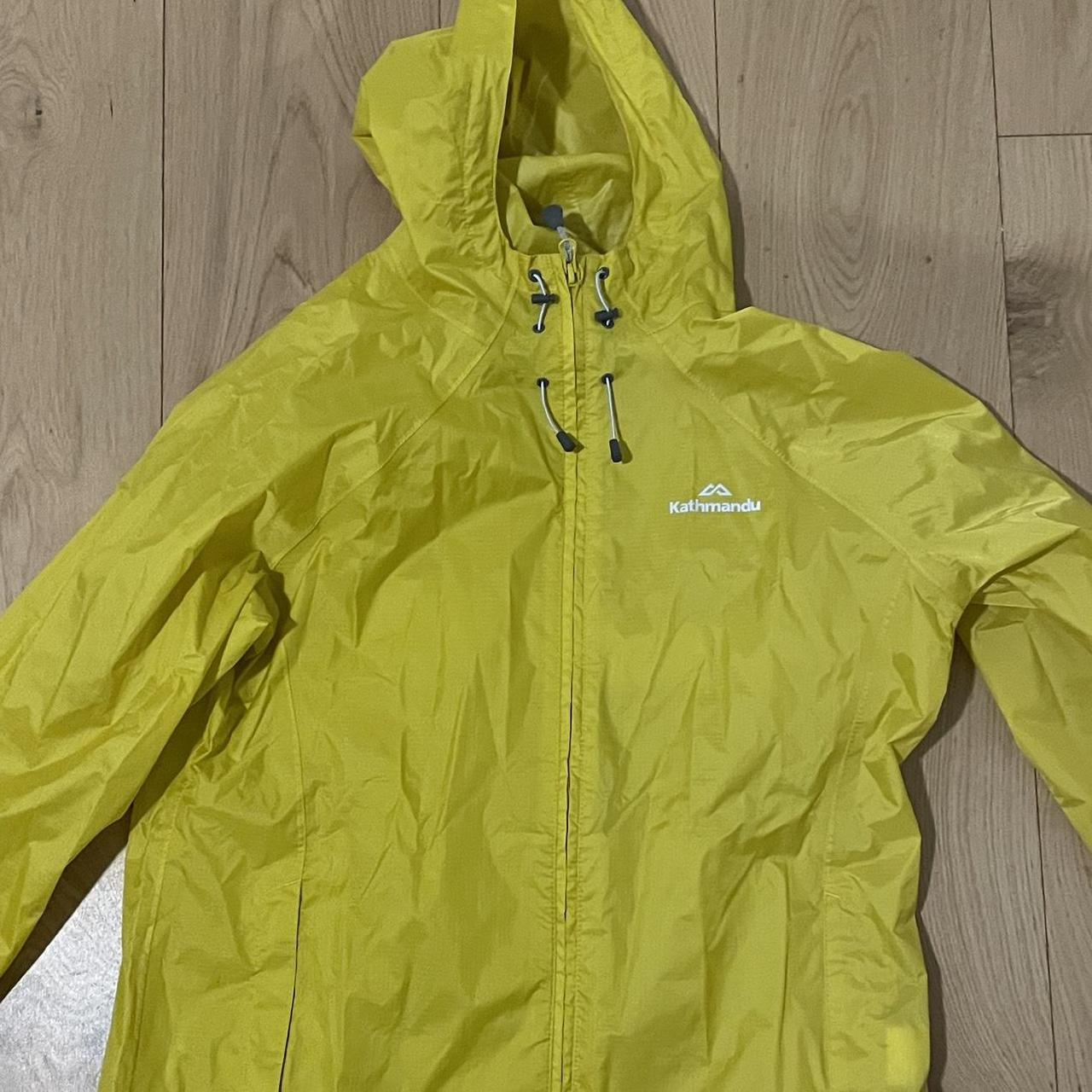 Yellow Kathmandu rain jacket. Kathmandu size says 12... Depop