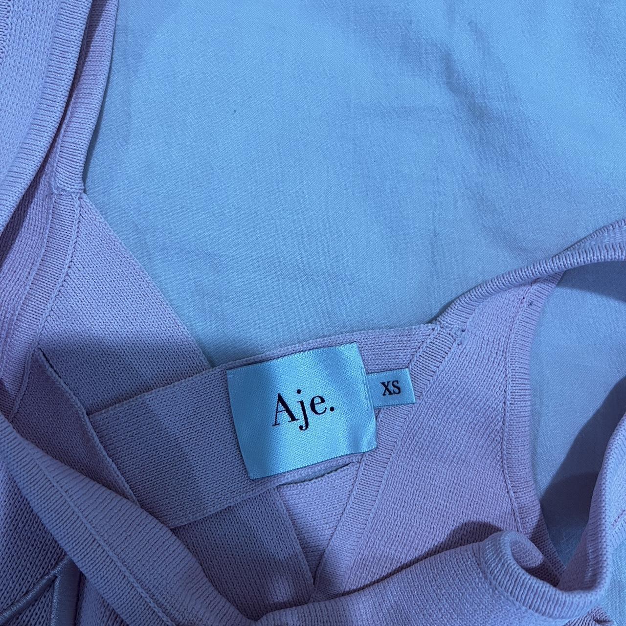 AJE Pink Crop Top with plait detail at the back-... - Depop