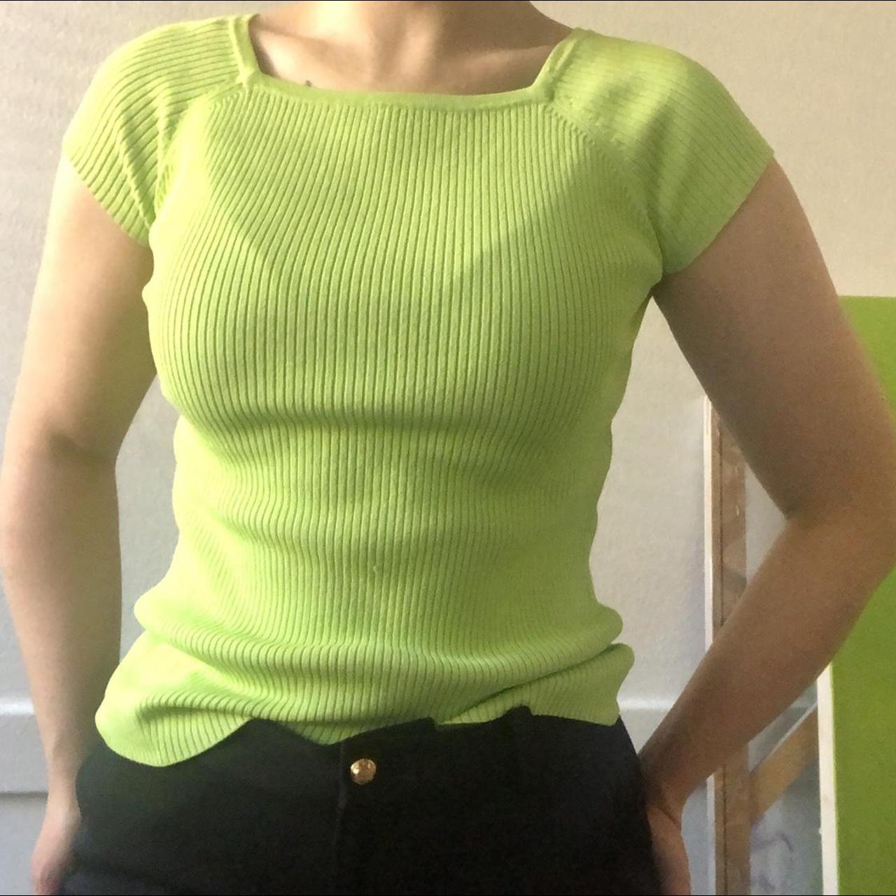 This ribbed knit top features capped sleeves and a... - Depop