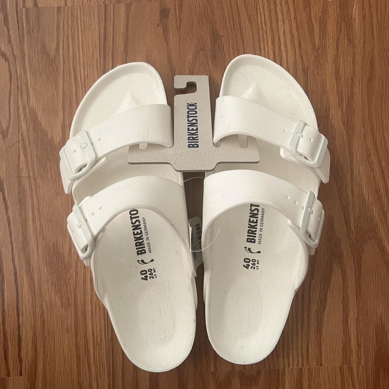 White birkenstocks sandals - small black spotstains... - Depop