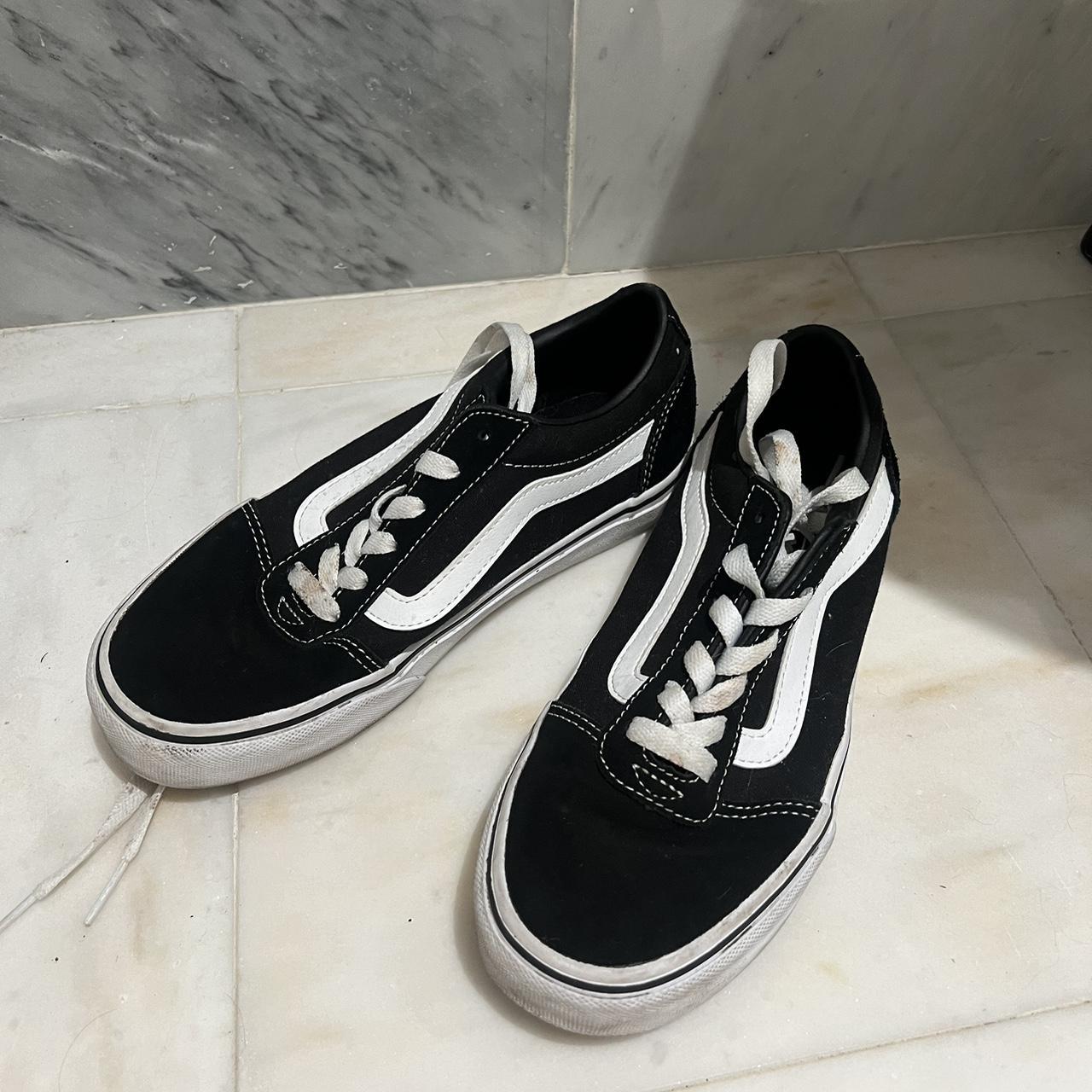 Black and white Vans trainers. Laces a bit stained Depop