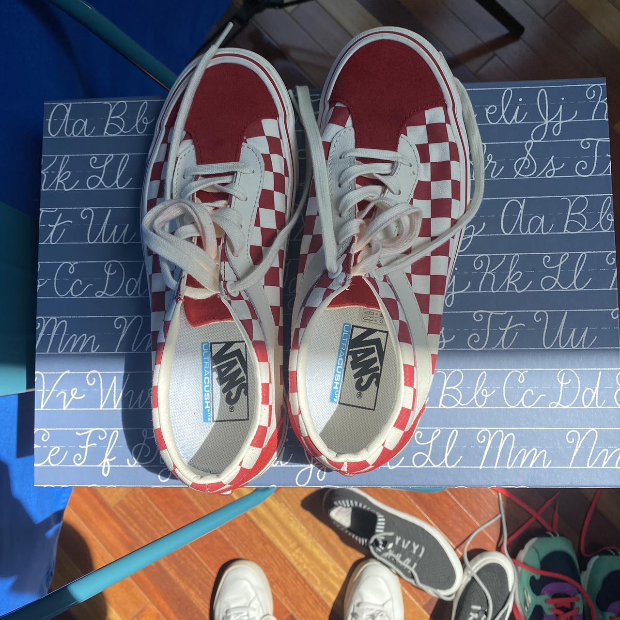 Red white and store blue checkered vans