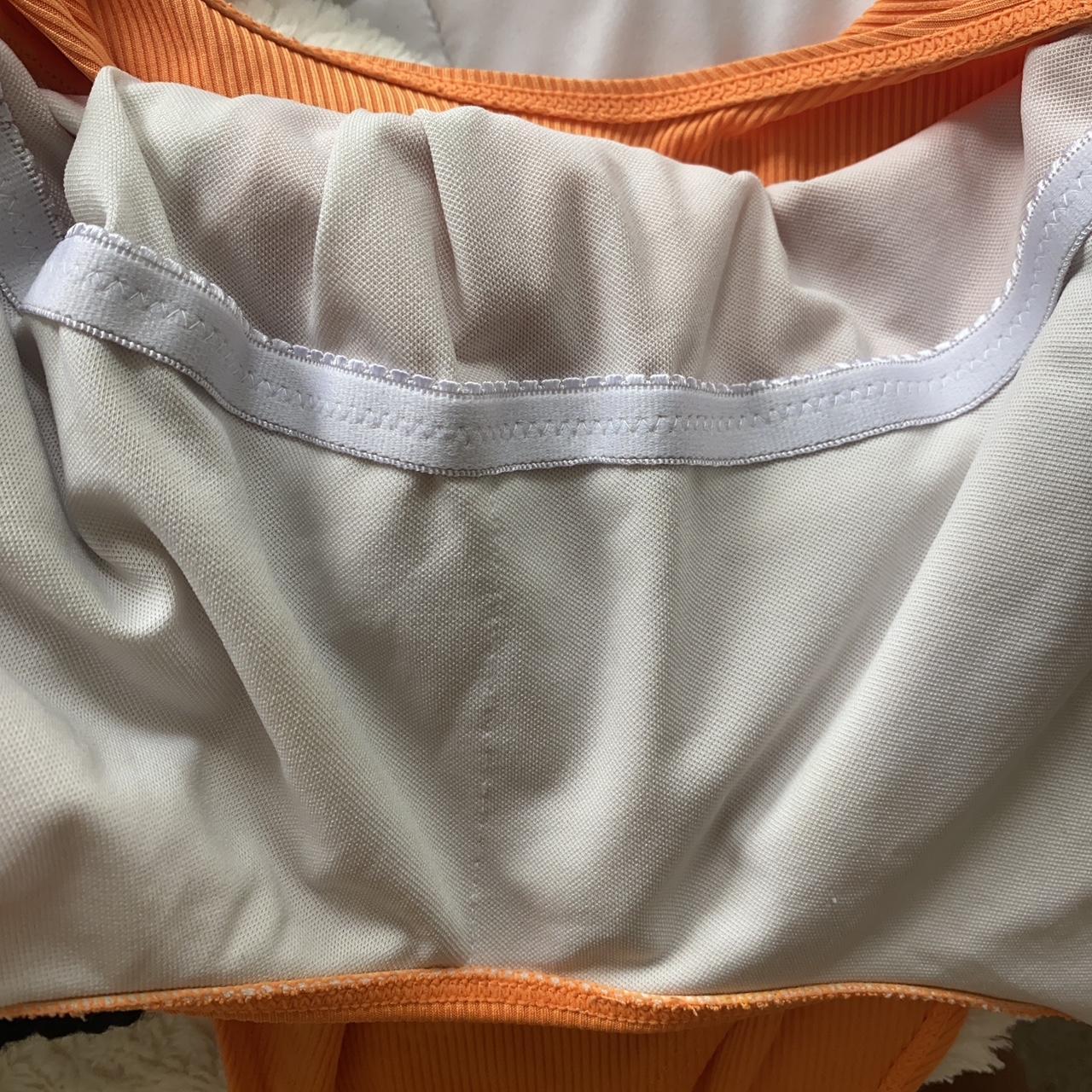 orange one piece size medium swim suit. low cut back... - Depop