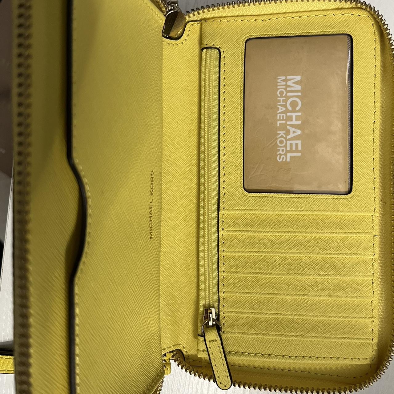 Yellow Michael Kors wallet good condition wore a