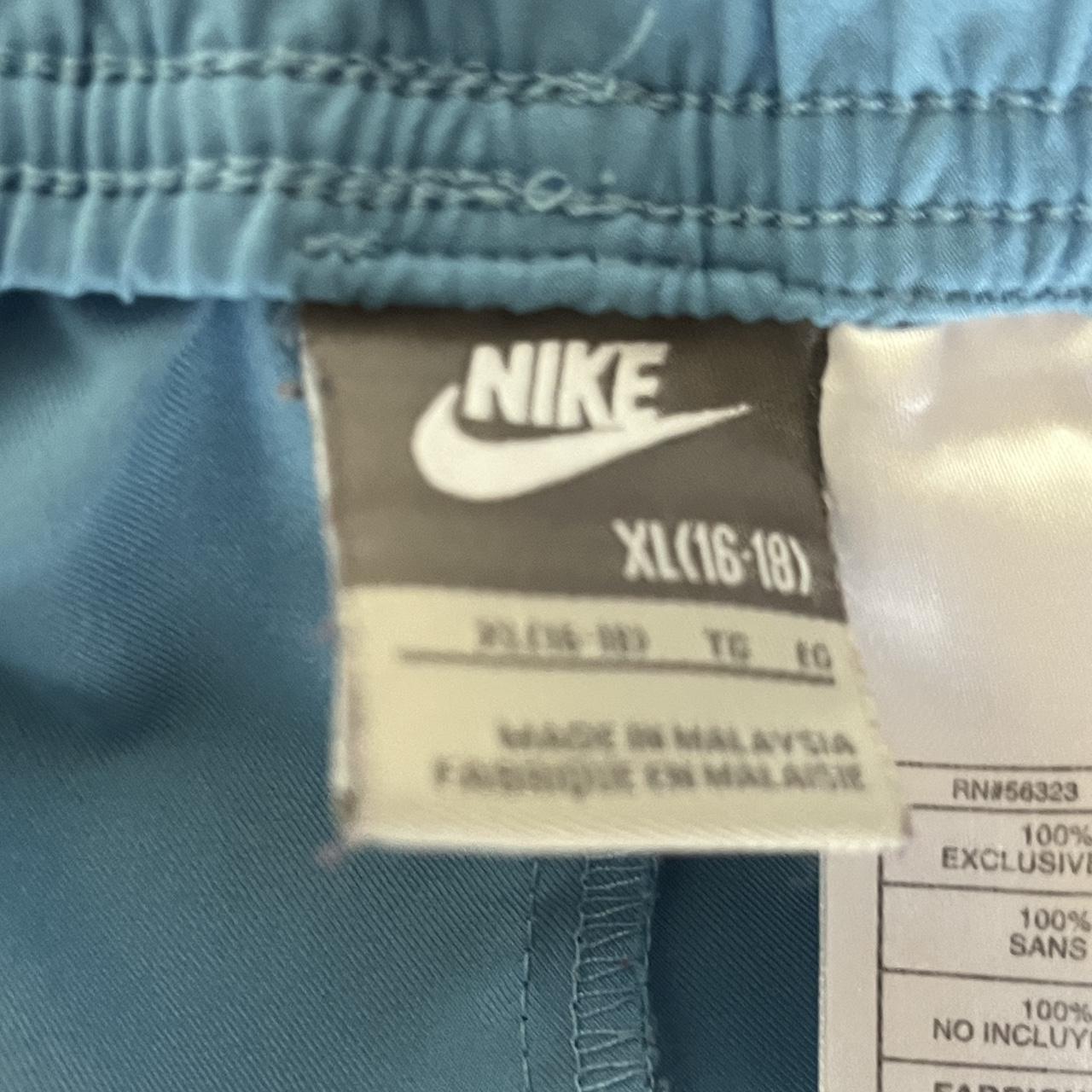 Baby blue Nike track... Depop
