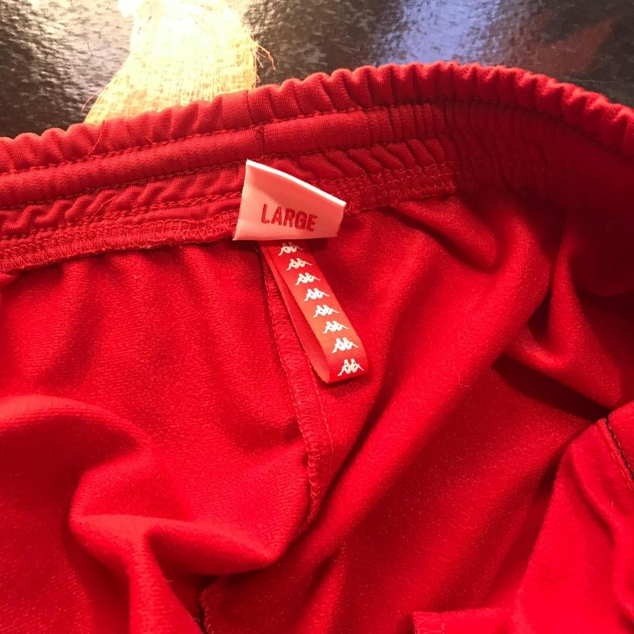 Red Kappa tear away pants. Cropped at the bottom.... Depop