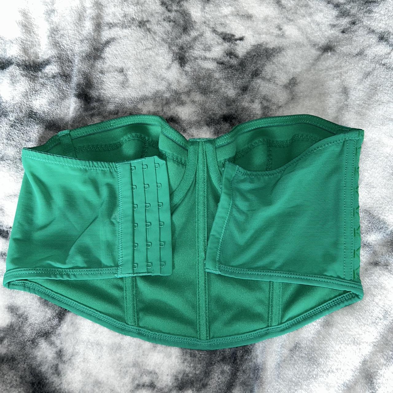 Primark green corset 32B but size wise it will fit... Depop