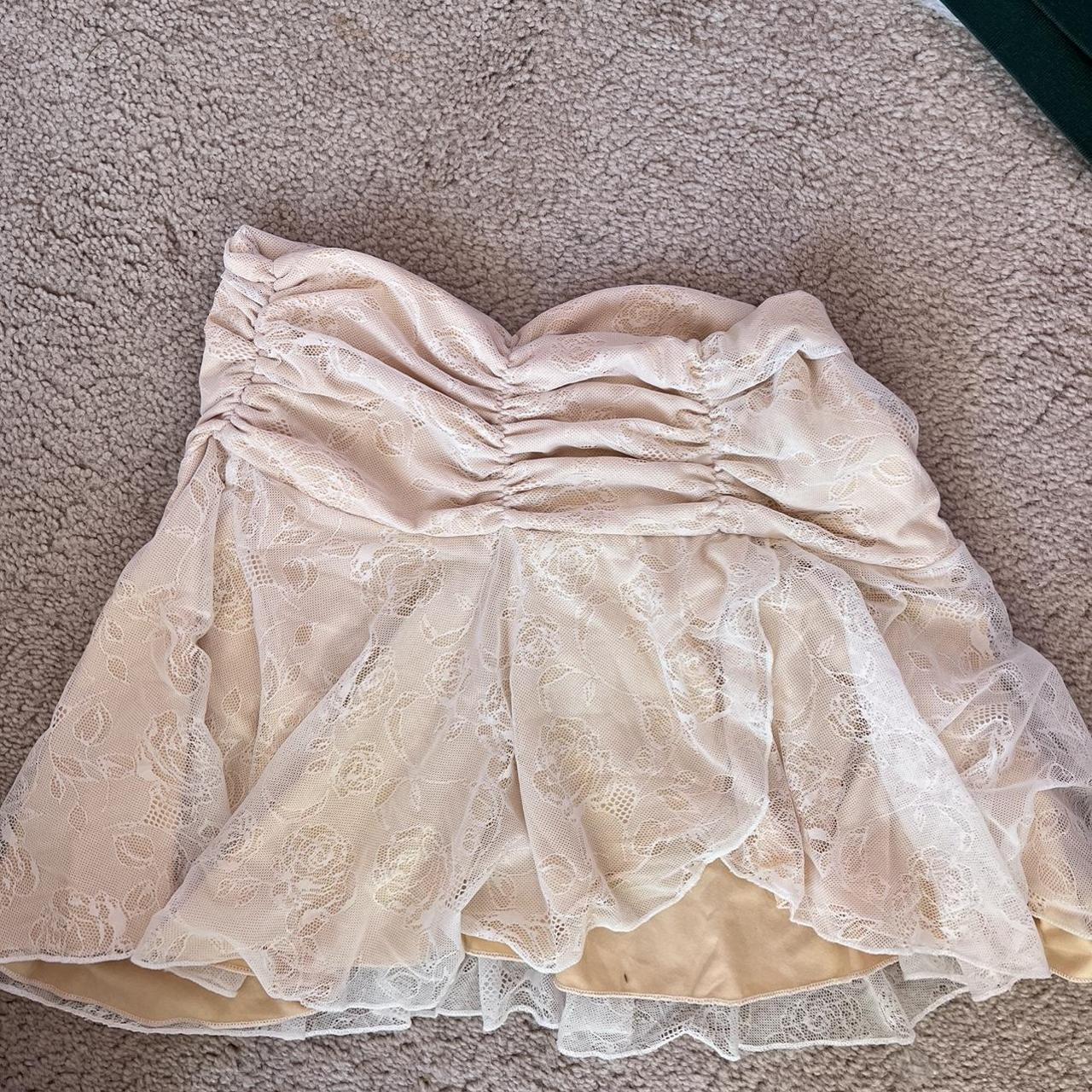 Lacy ruffled mini skirt with rose detail Size S/M... - Depop