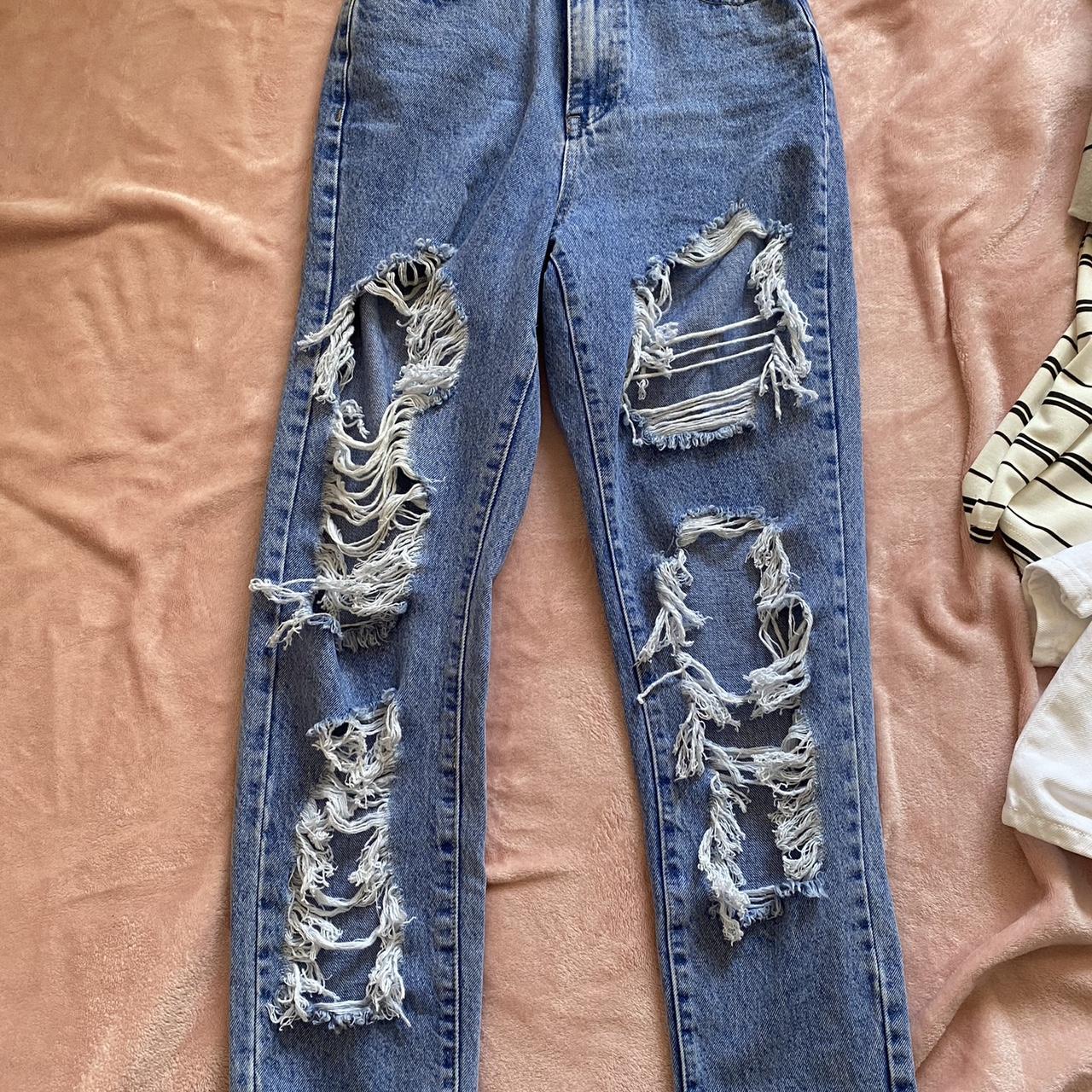Blue distressed jeans with a baggy