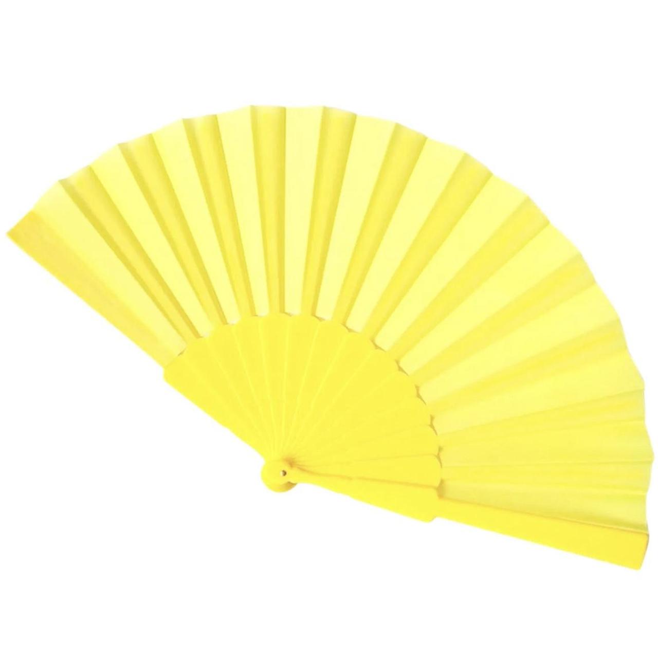 Yellow folding fan Absolute must have for raving in... - Depop