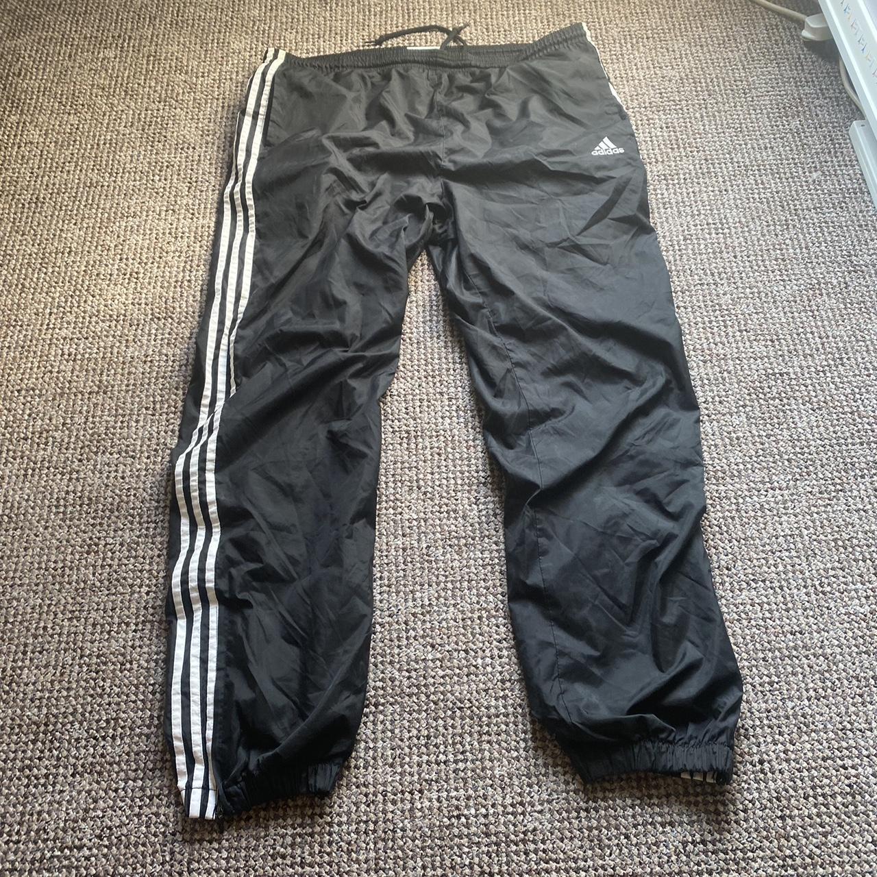 Vintage black adidas track pants Cuffed States... - Depop