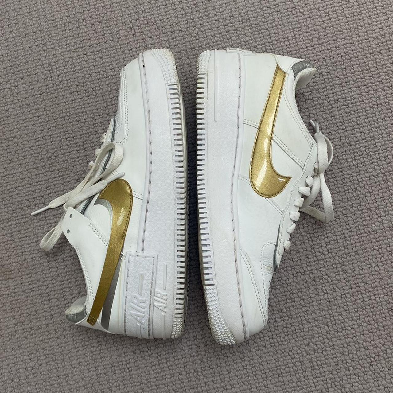 White airforce ones with gold and silver tick. Only