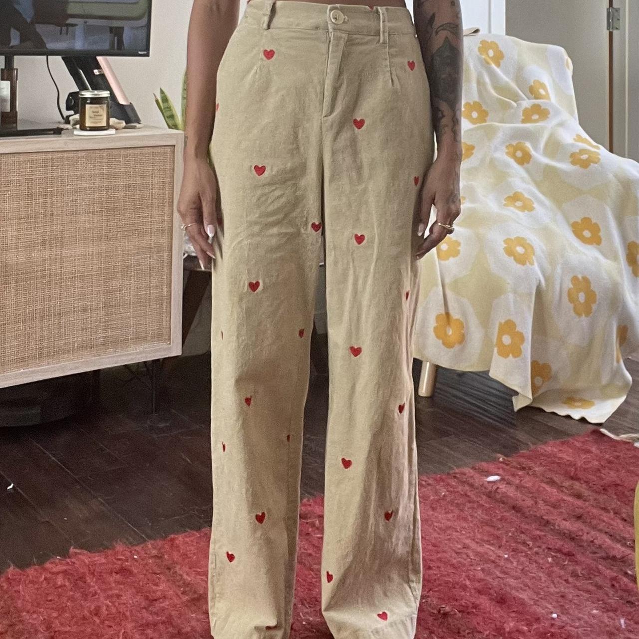 Tan Cider corduroy pants with heart embroidery.... Depop