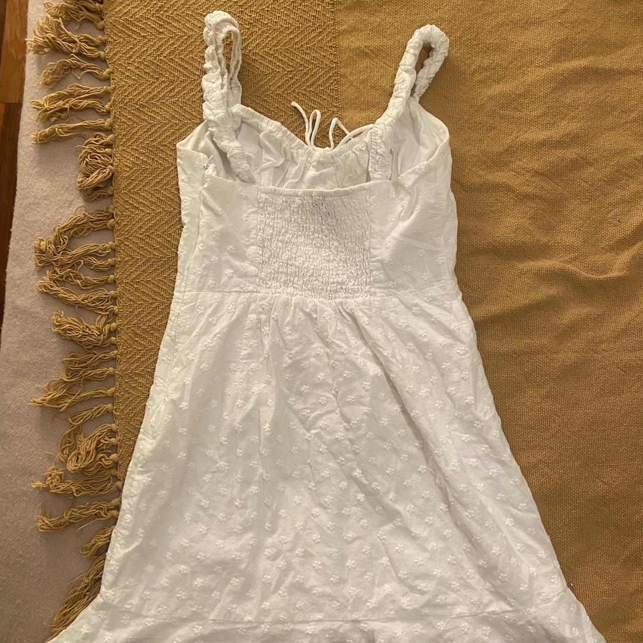 LUCK & TROUBLE White mini dress with flower... - Depop