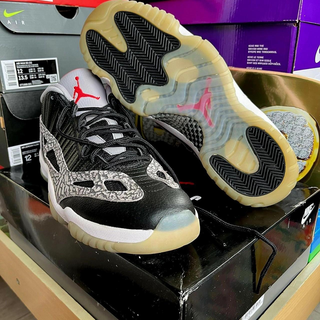 jordan 11 low black cement on feet