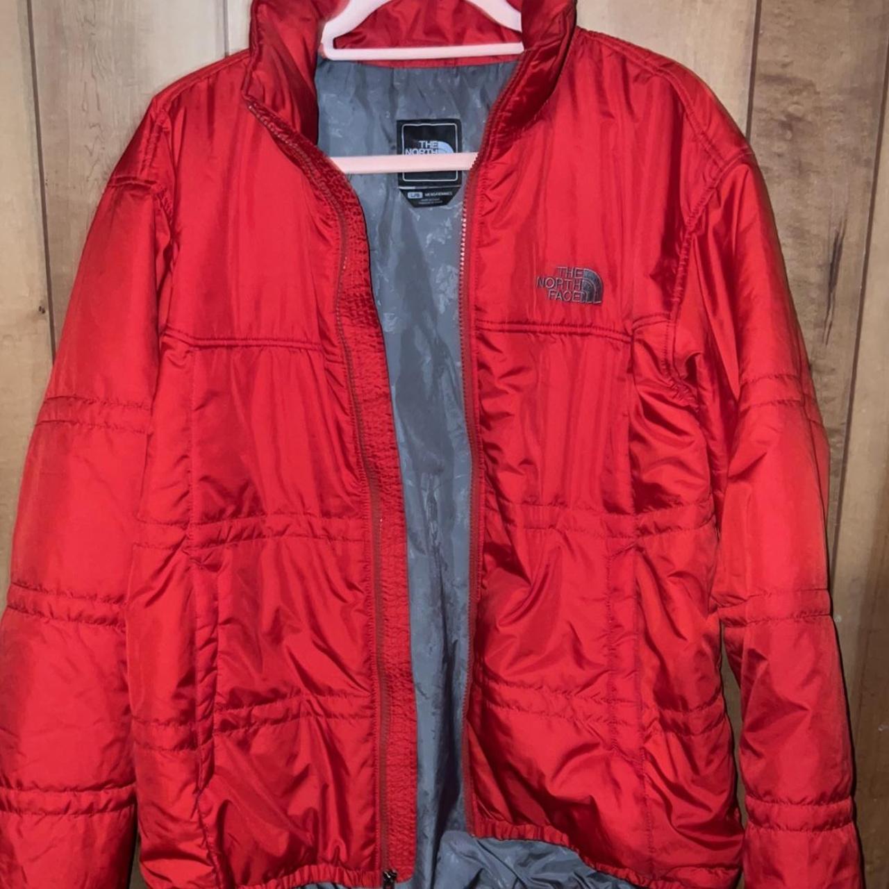 North Face puffer jacket it. Looks like a bright red... Depop