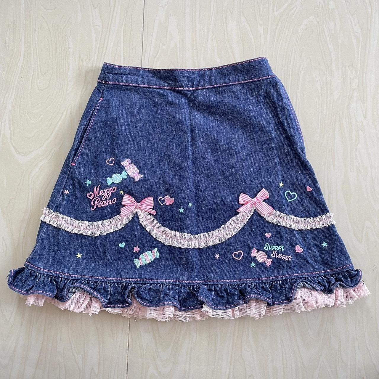 Mezzo piano jeans skirt decorated with a pink... - Depop