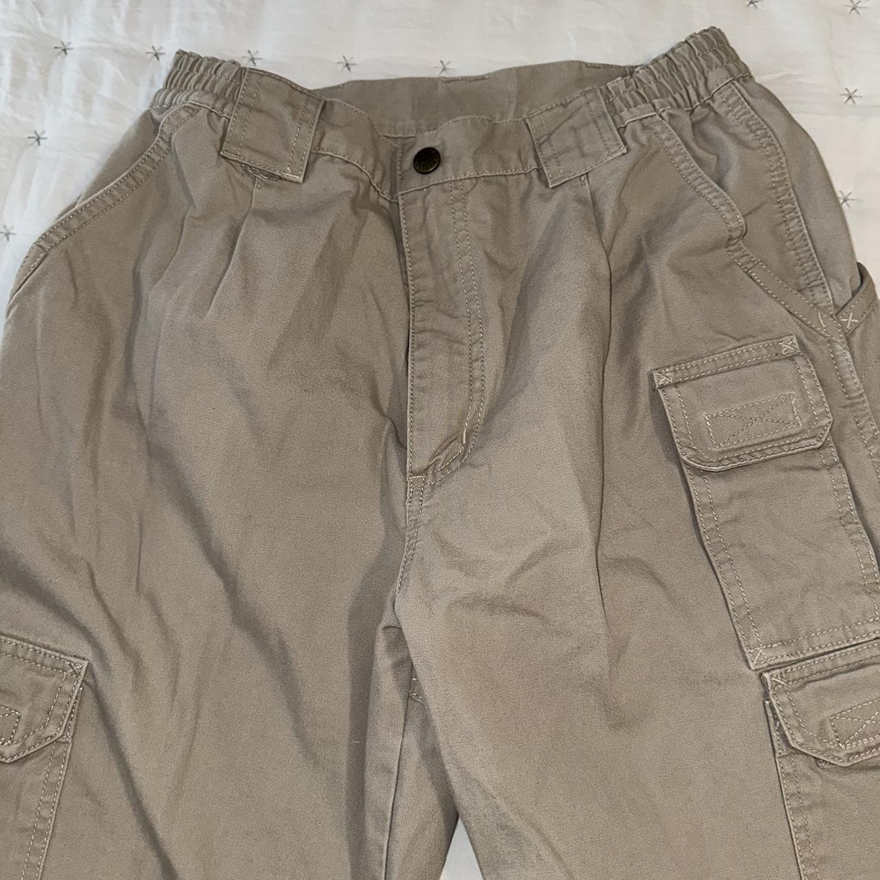Tan cargo pants. Stretchy waistband. Thick material... - Depop