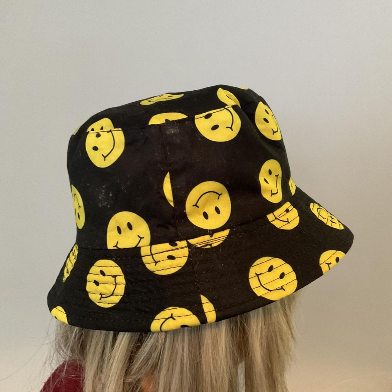 Smiley face bucket hat, shown on head circumference... Depop