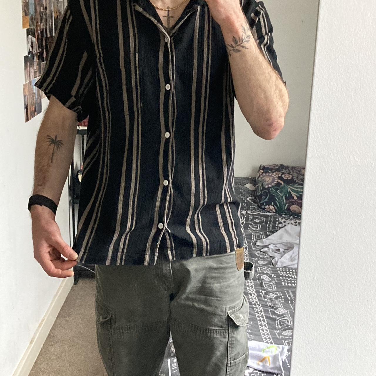 Urban outfitters black & gold striped shirt // Size... Depop