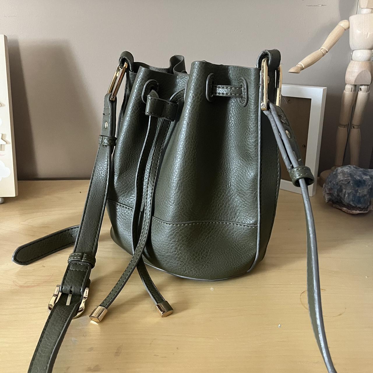 super cute olive green bucket bag!! no compartments... Depop