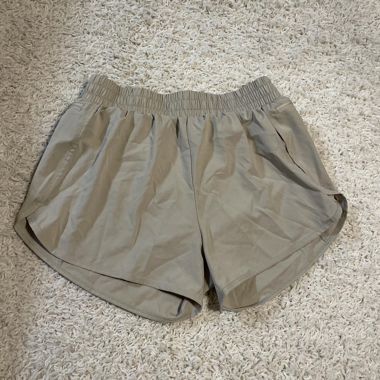 Small khaki athletic shorts, zipper pockets, elastic... Depop