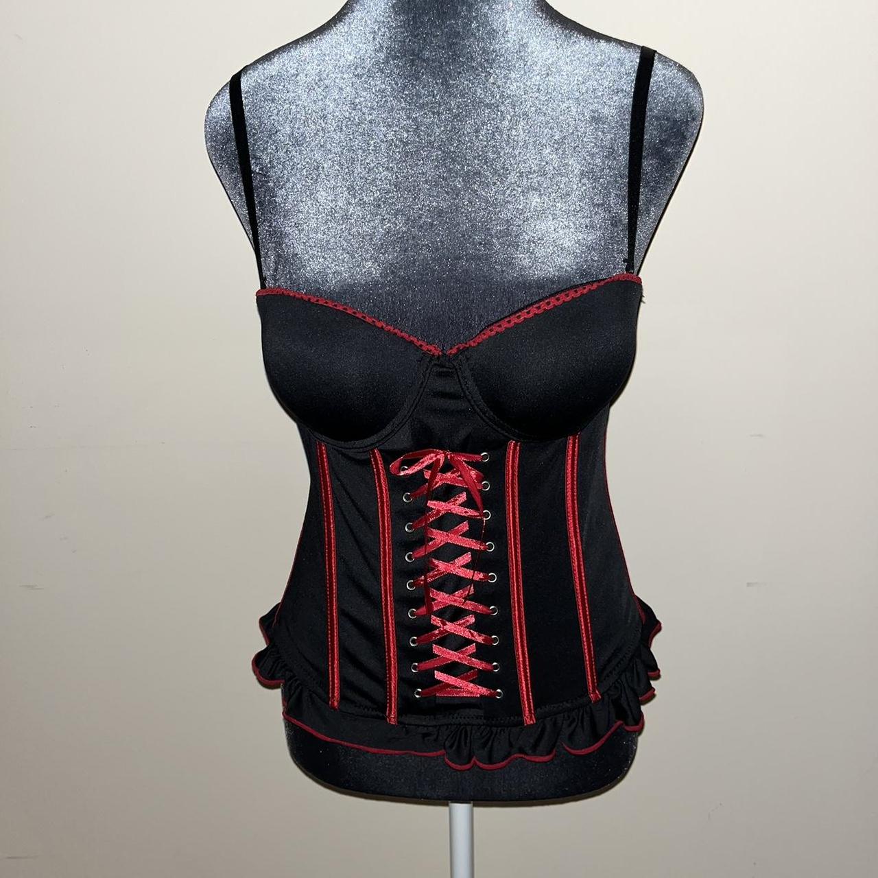 red corset top by the brand vaacodor. features black - Depop