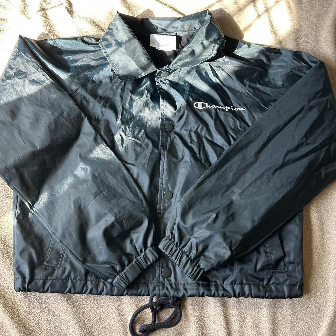 Black cropped champion rain jacket. It cinches at... Depop
