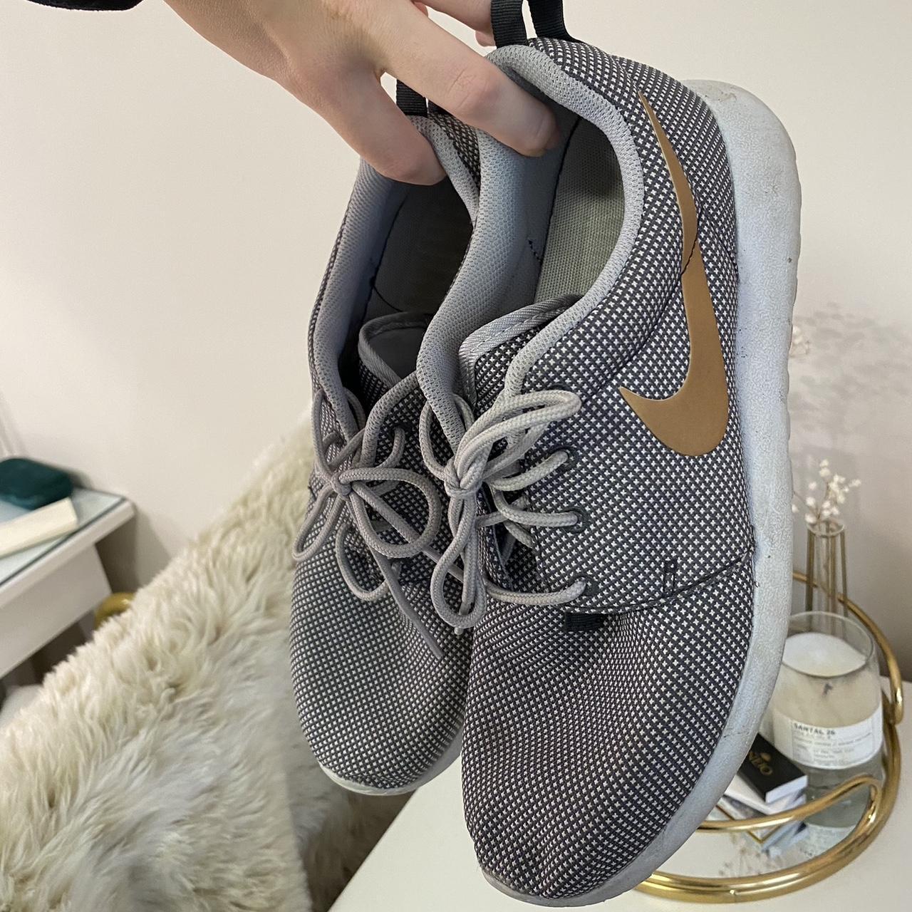 grey nike shoes with gold swoosh