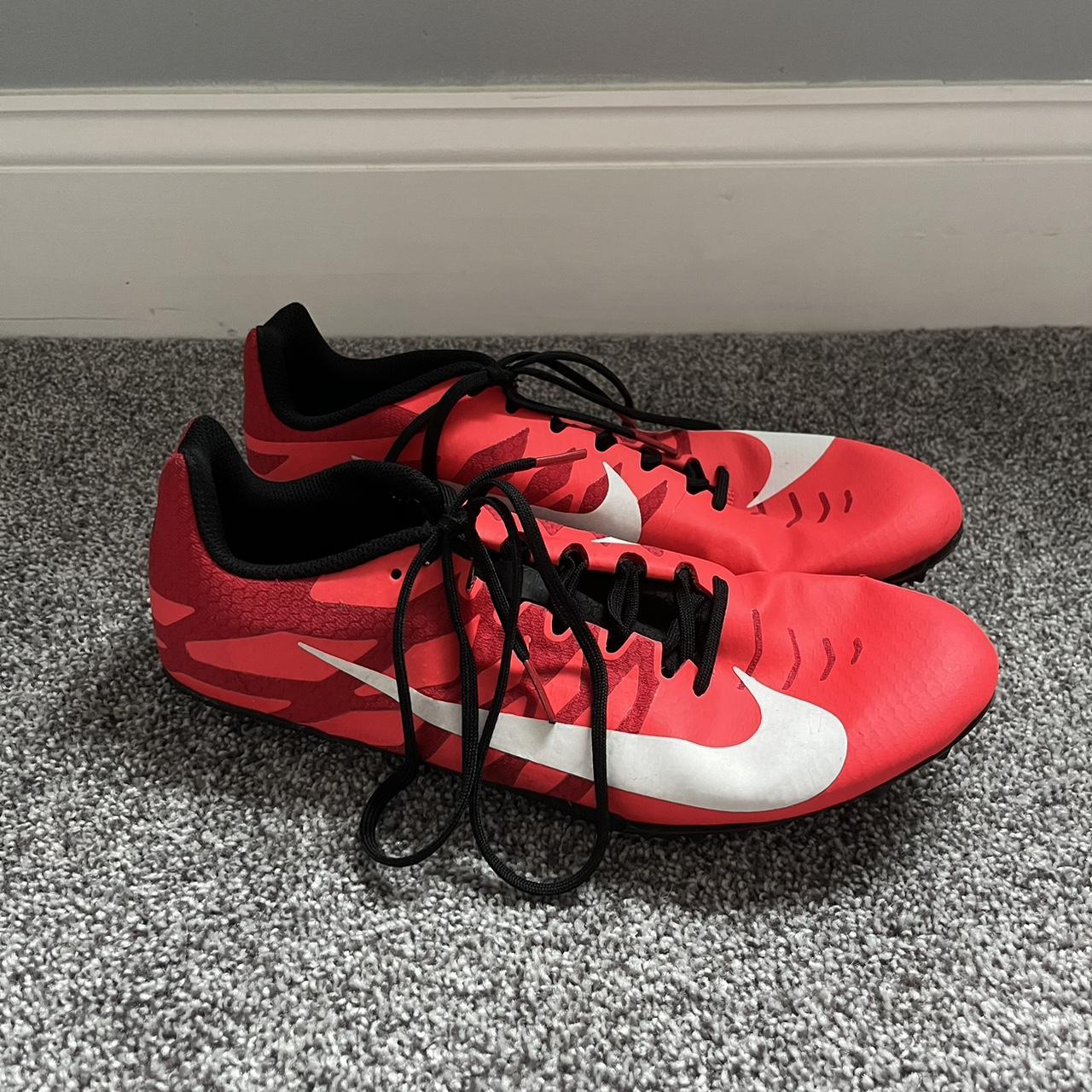 red nike spikes