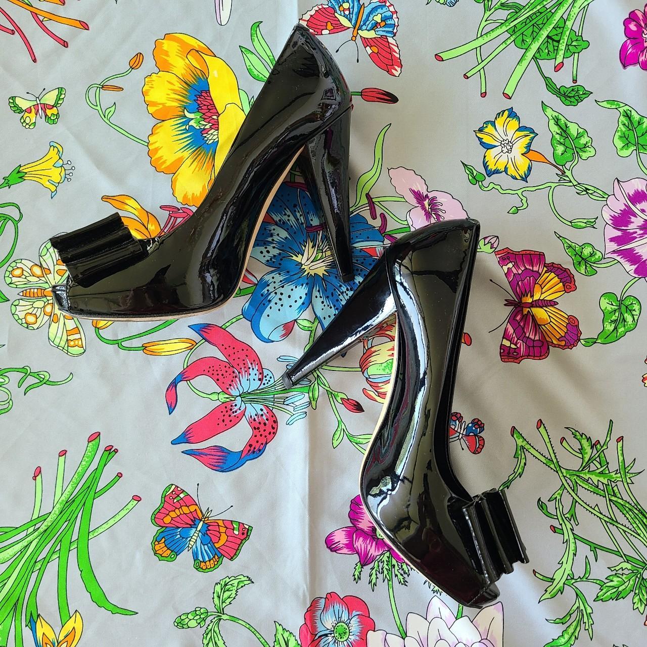 Black patent leather peep toe bow heels by Bally