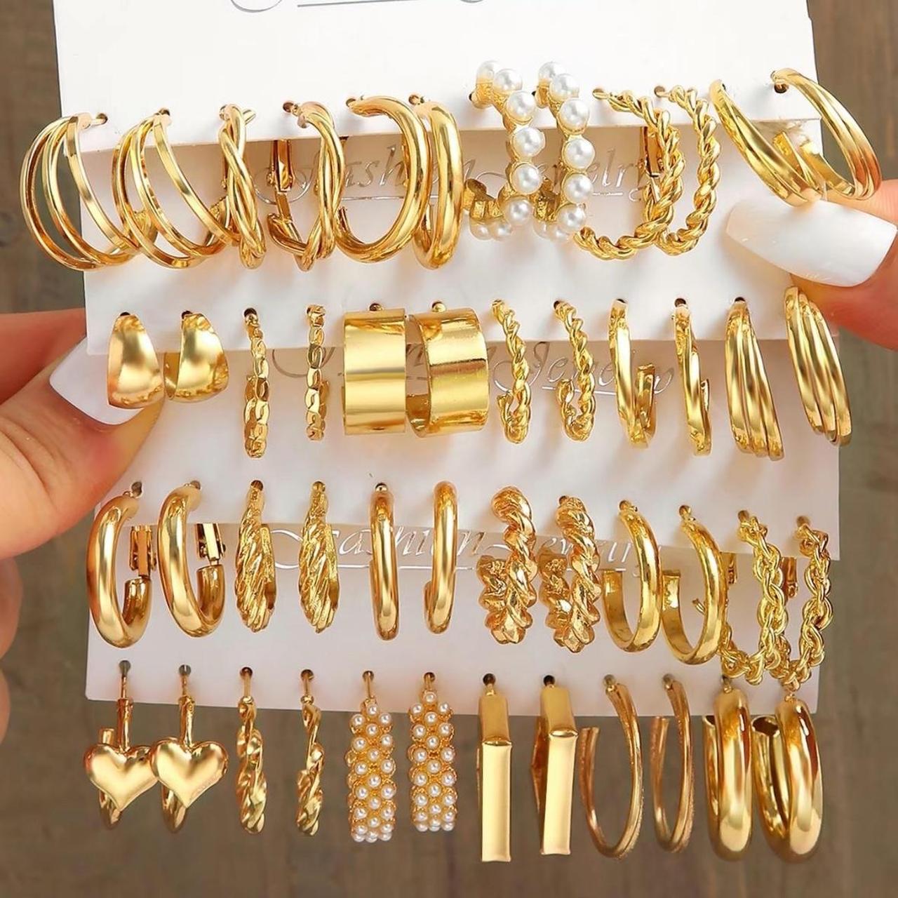 set of gold earrings brand new bag hasnt been opened - Depop