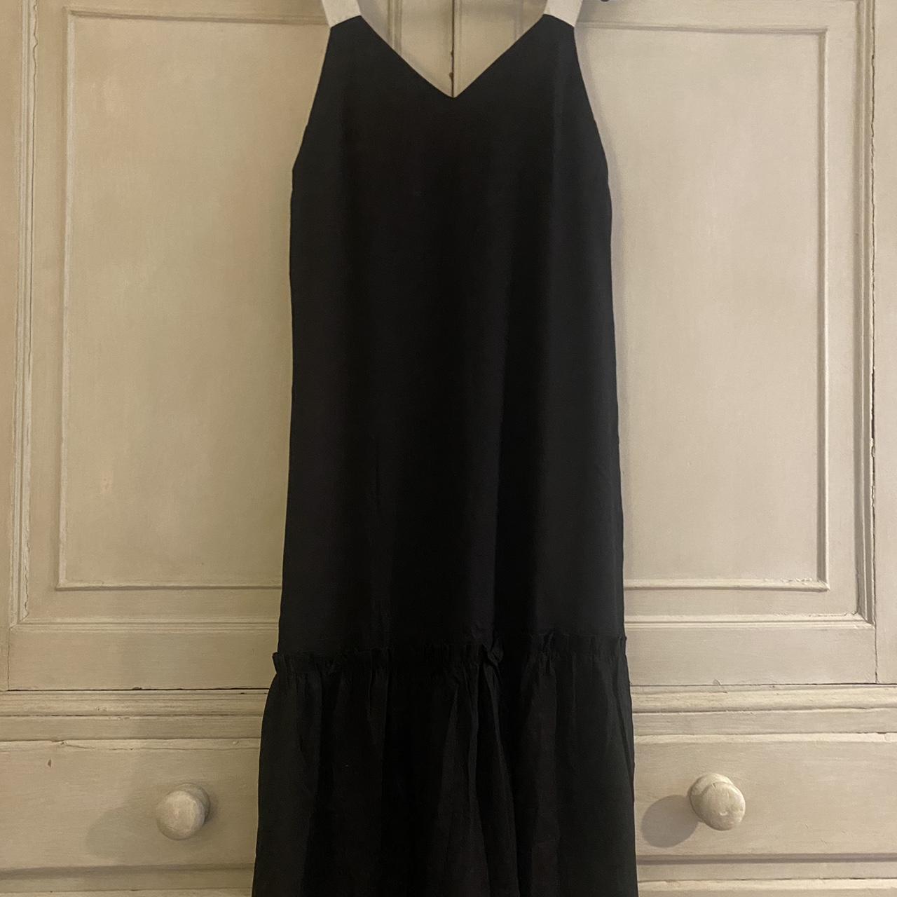 Chic black linen dress with cream ribbon tie straps.... Depop