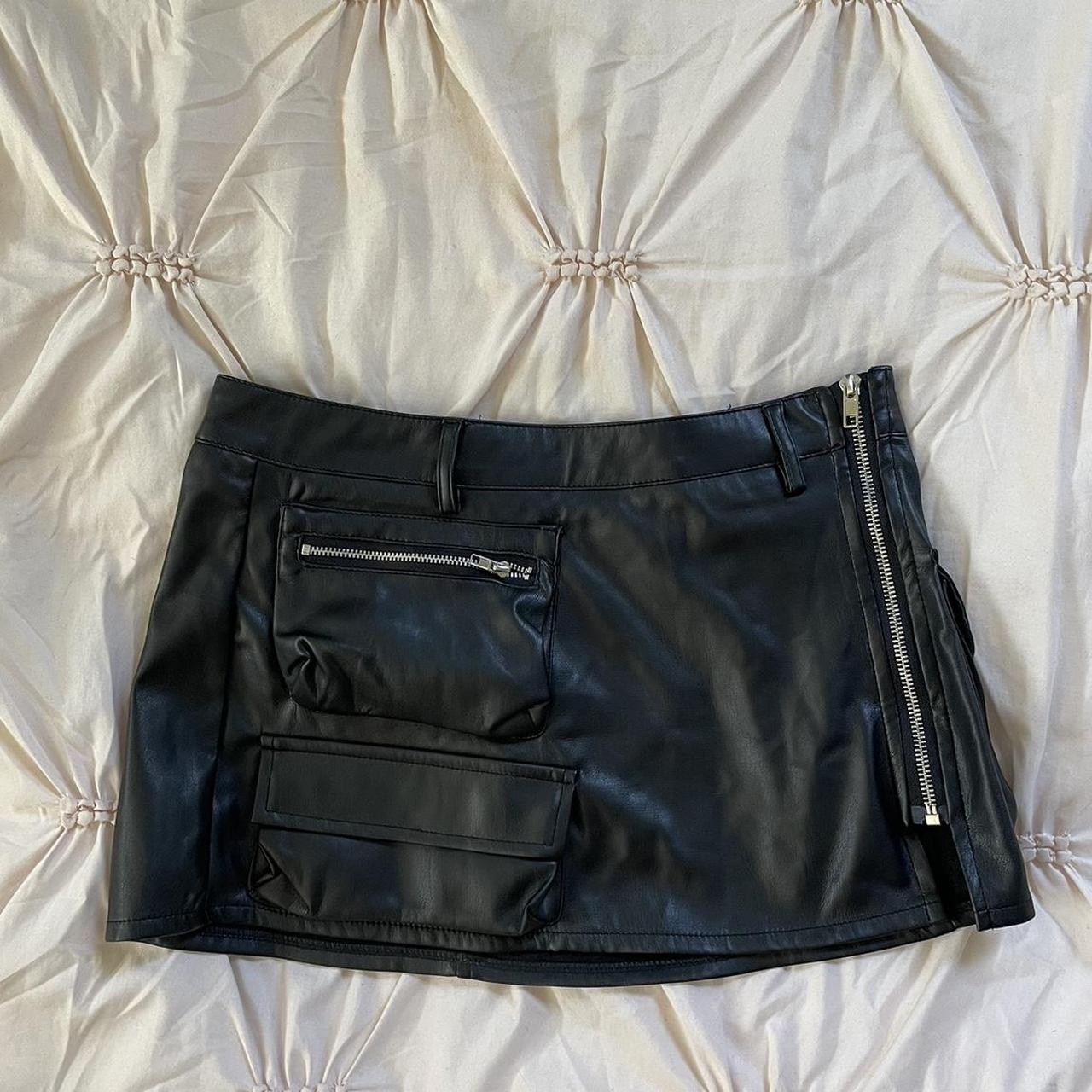 black leather mini skirt with pockets and a side... - Depop