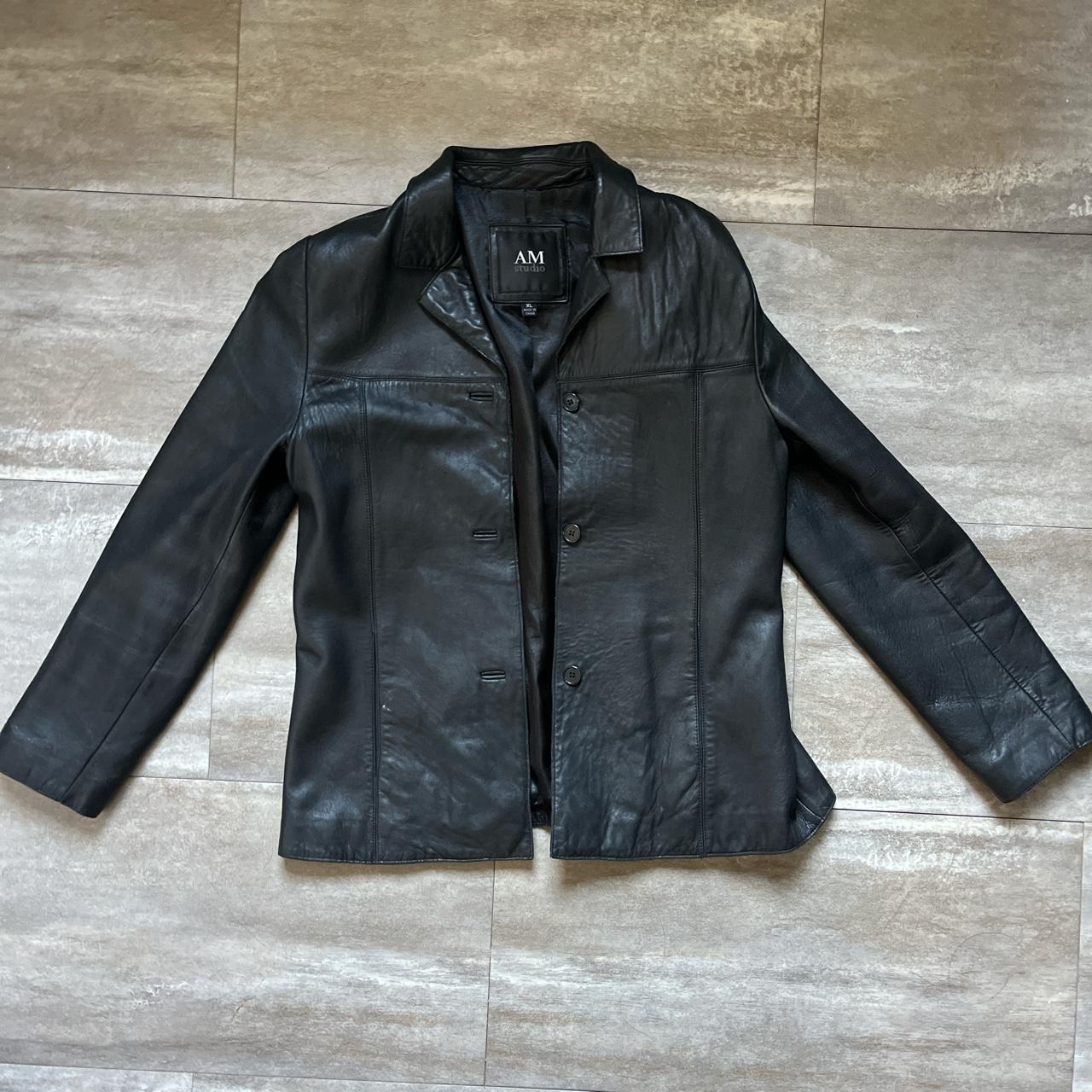 black leather jacket top button is a little loose XL... - Depop