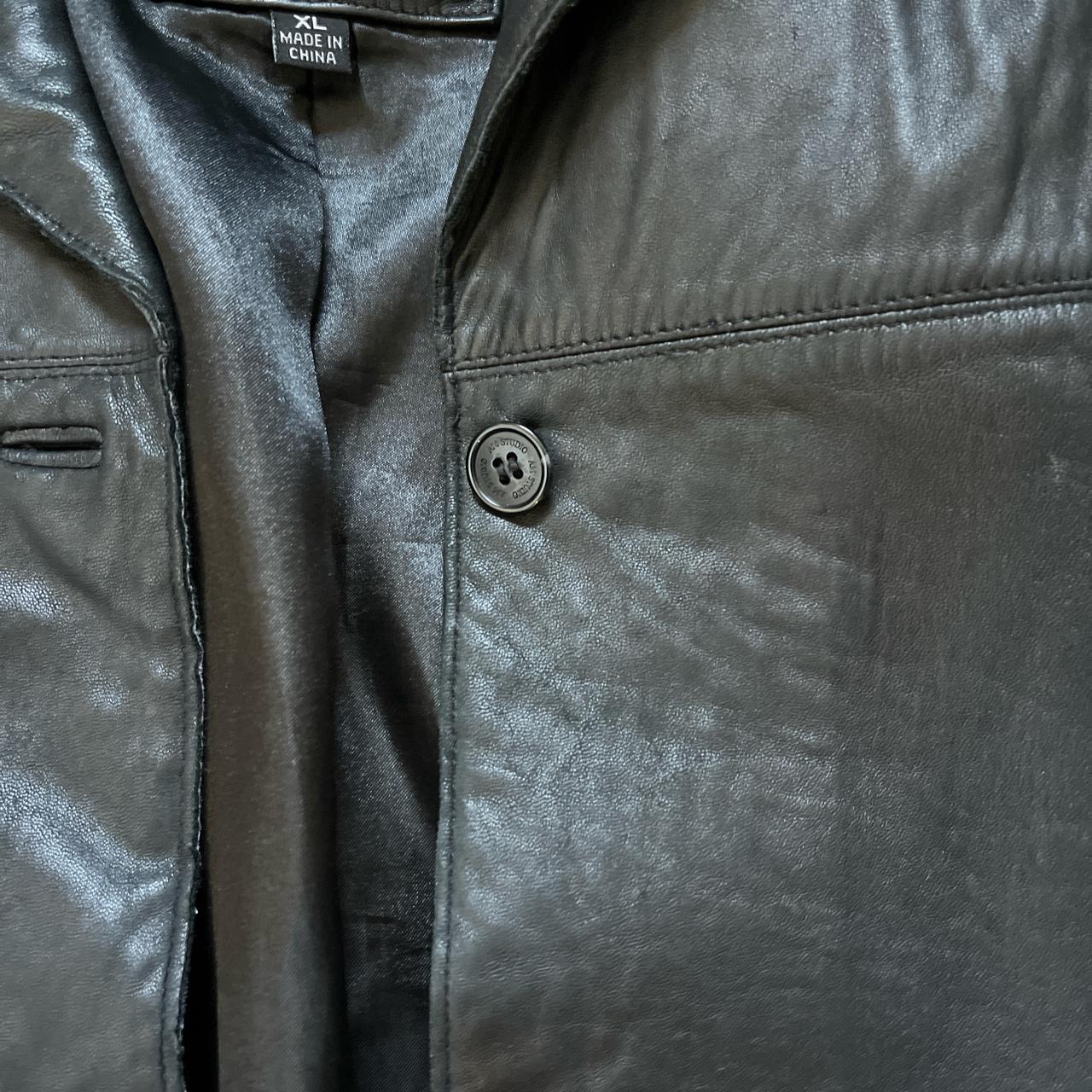 black leather jacket top button is a little loose XL... - Depop