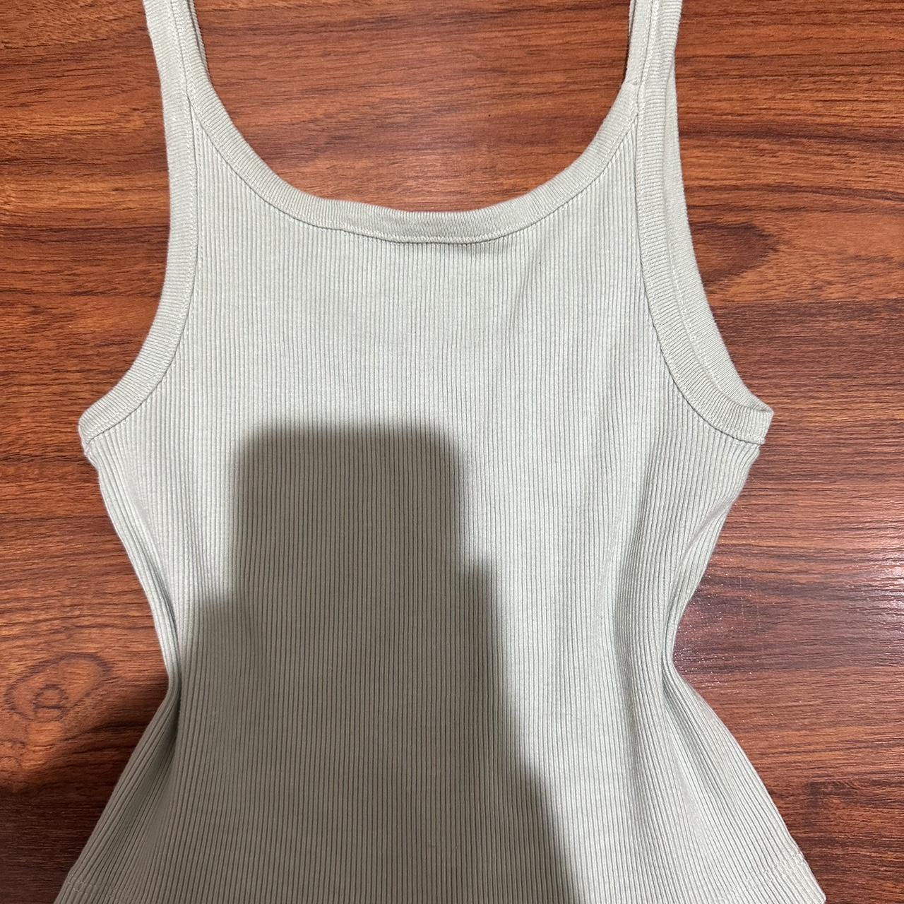 Brandy Melville Beyonca crop tank in light - Depop