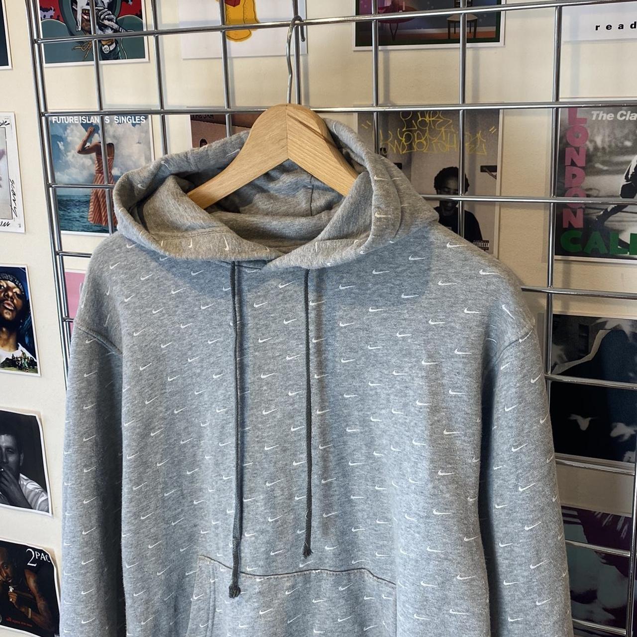 grey nike jumper with ticks all over