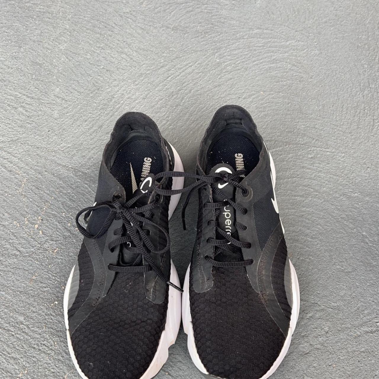 Nike black and white running shoe. Womens US size 9 - Depop