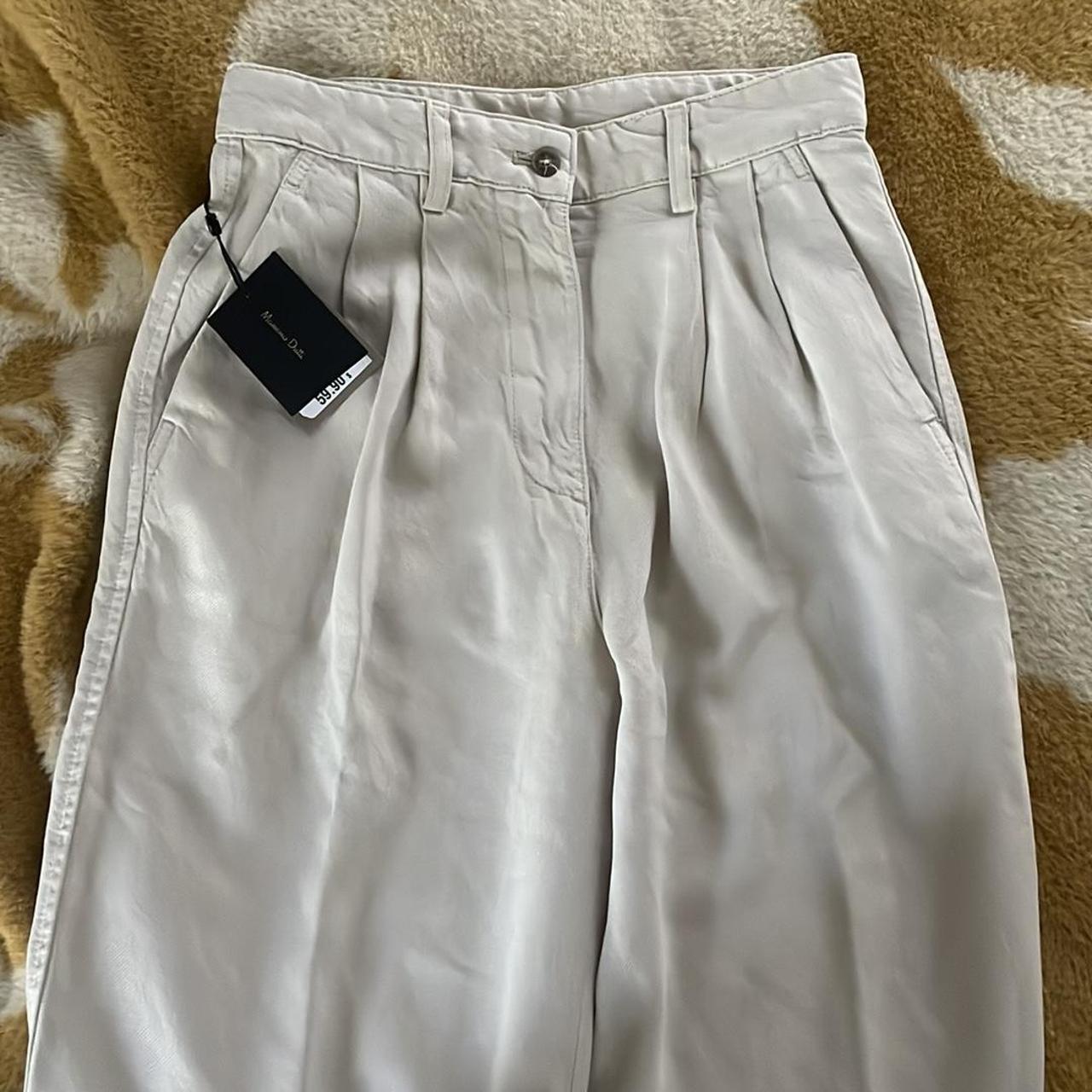 Massimo Dutti loose-fit lyocell trousers Beige Never... - Depop