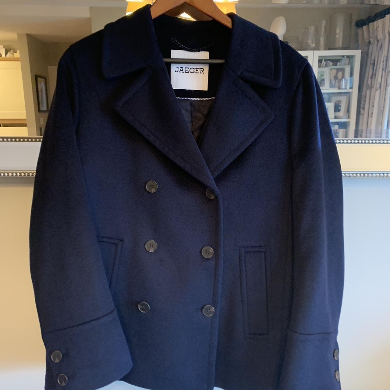 This timeless pea coat by Jaeger is crafted from... - Depop