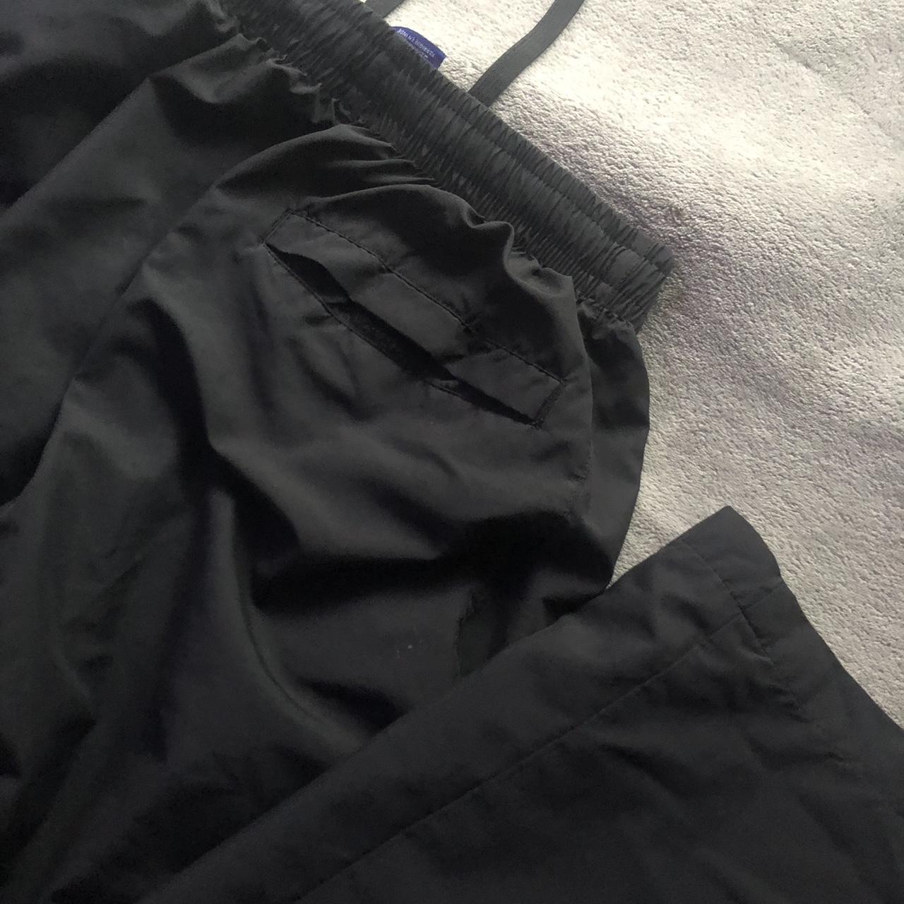 nike parachute pants just fit a size 6 but running a... - Depop