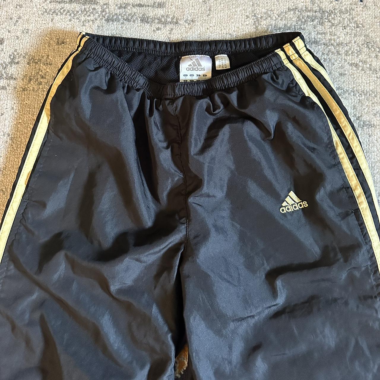 Black and yellow adidas track pants - Depop