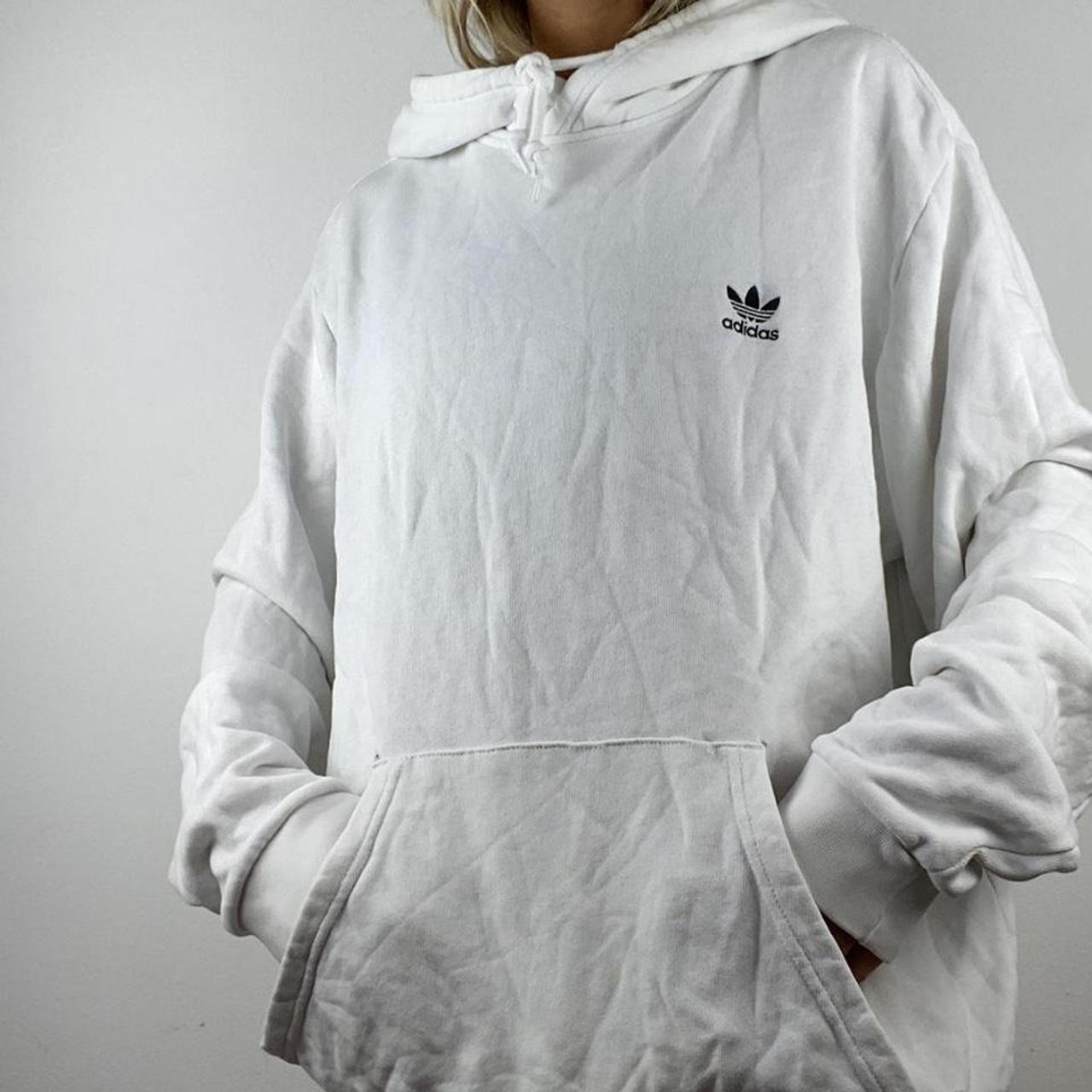 white adidas hoodie XL has 2 mini holes by pocket... Depop